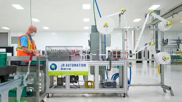 GM engineers working on final testing and validation for the medical mask assembly line.