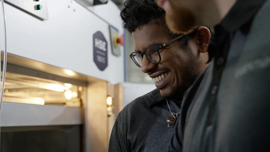 people viewing the additive manufacturing process