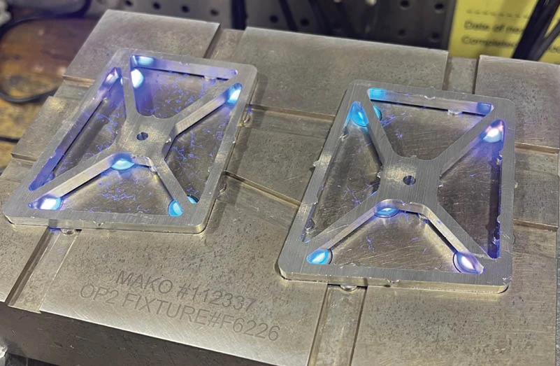 Surgical navigation array in fixtures undergoing Blue Photon bonding process.