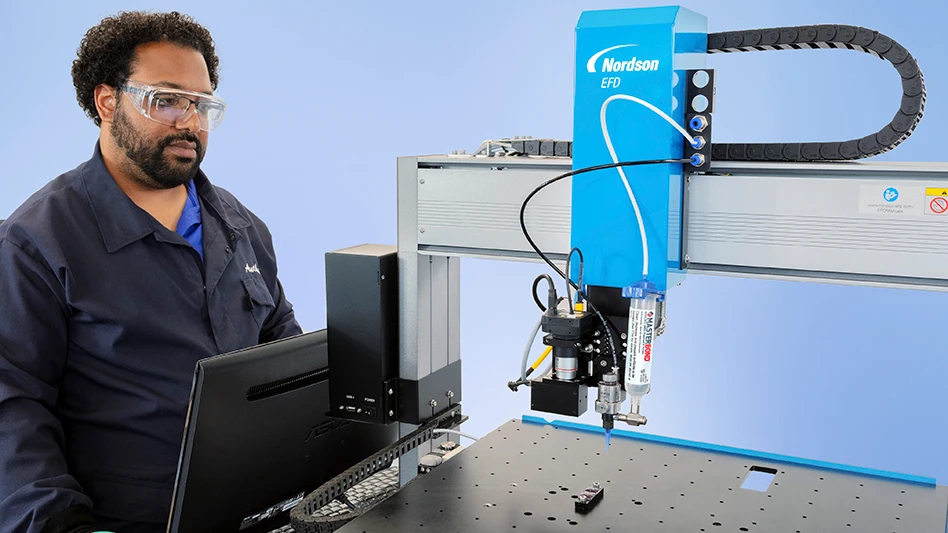 A person working at a machine