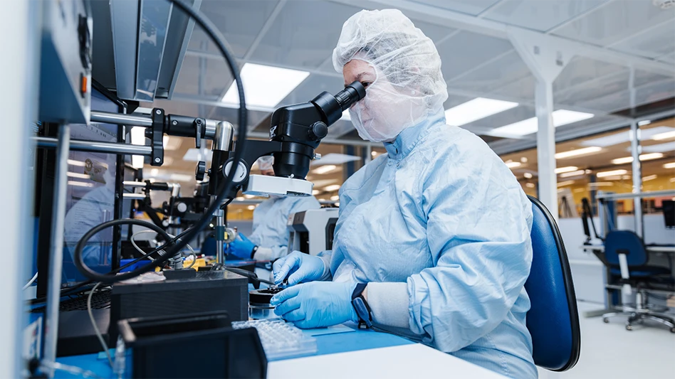 A person looking through a microscope