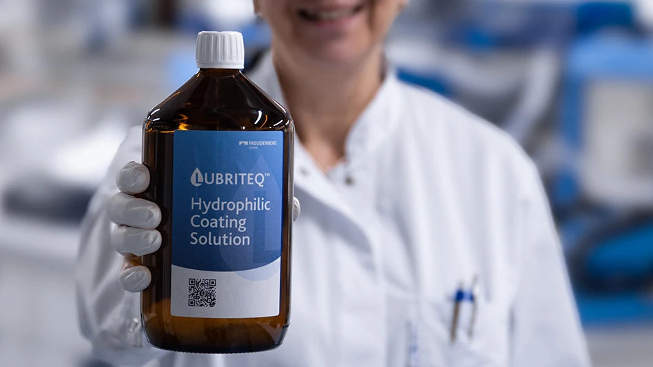 A person holding a chemical bottle