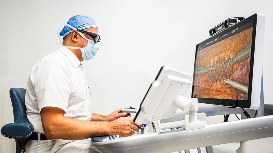 A surgeon working at a computer