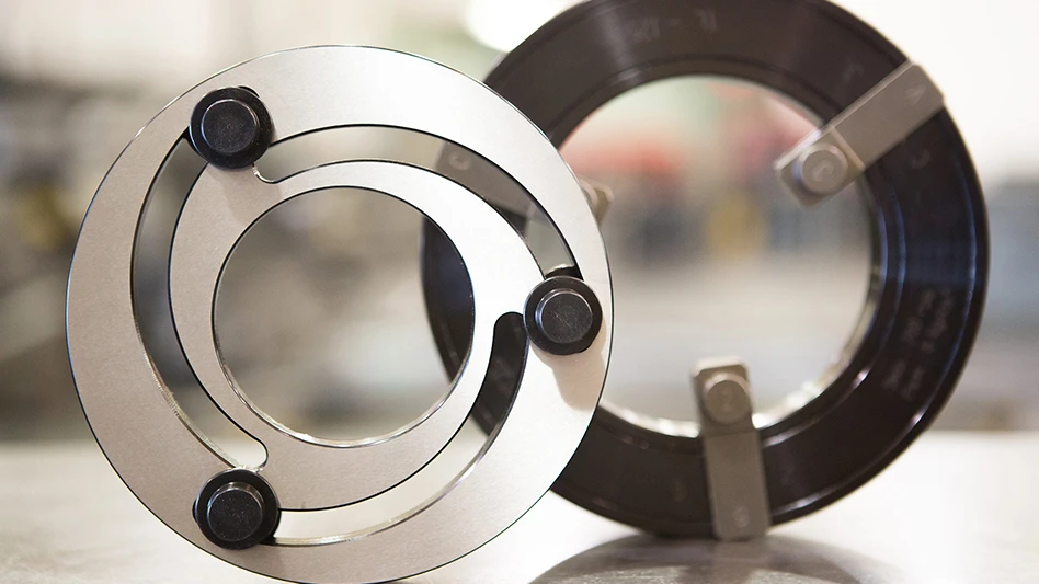 A silver ring in front of a black one